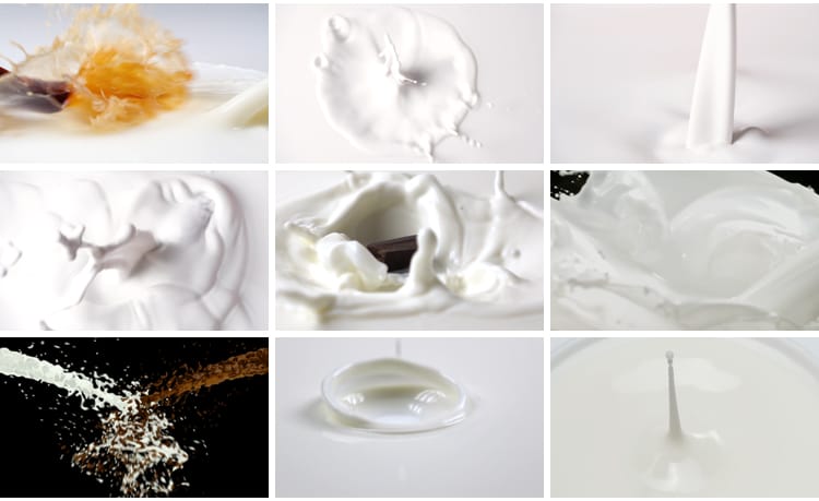 特写牛奶乳制品泼飞滴落溅起升高慢镜头摆拍鲜奶液体高清视频素材